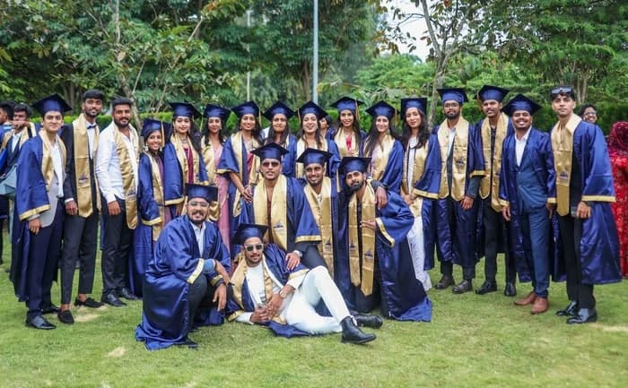 Graduates in blue convocation robes