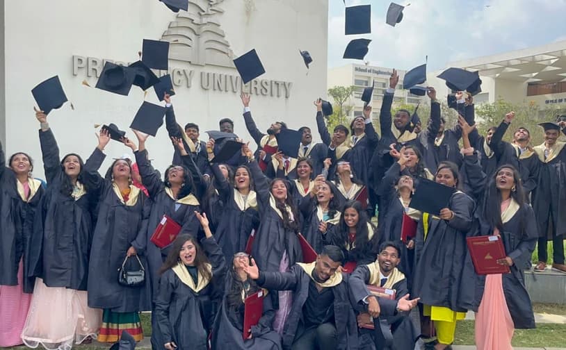 Graduates tossing their caps