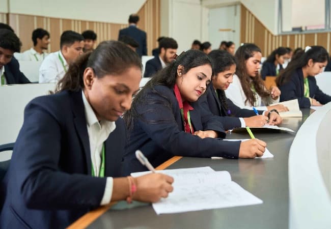 Students writing examinations