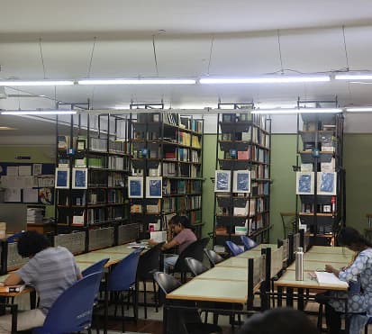 Students reading at tables in the library