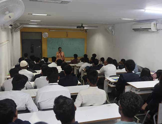 Students attending a session in a classroom