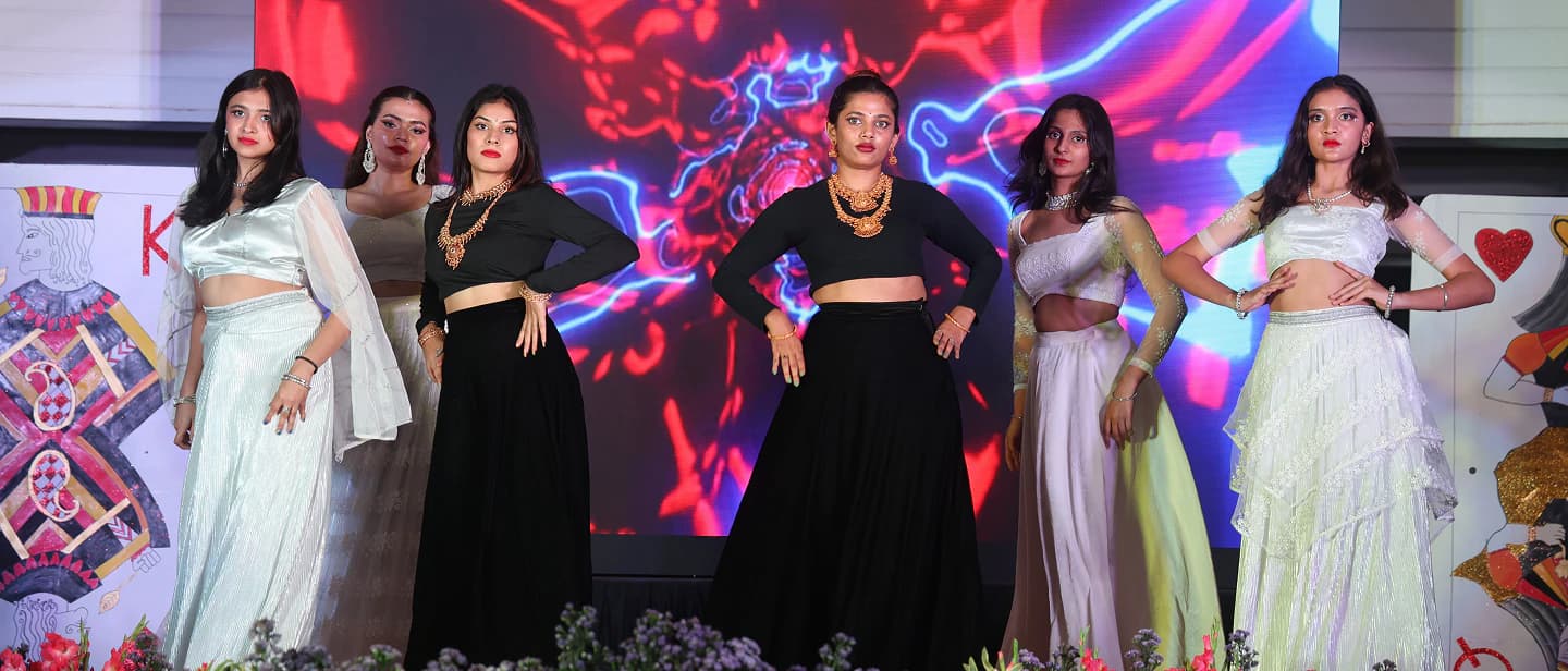 Students performing on stage at a college cultural event